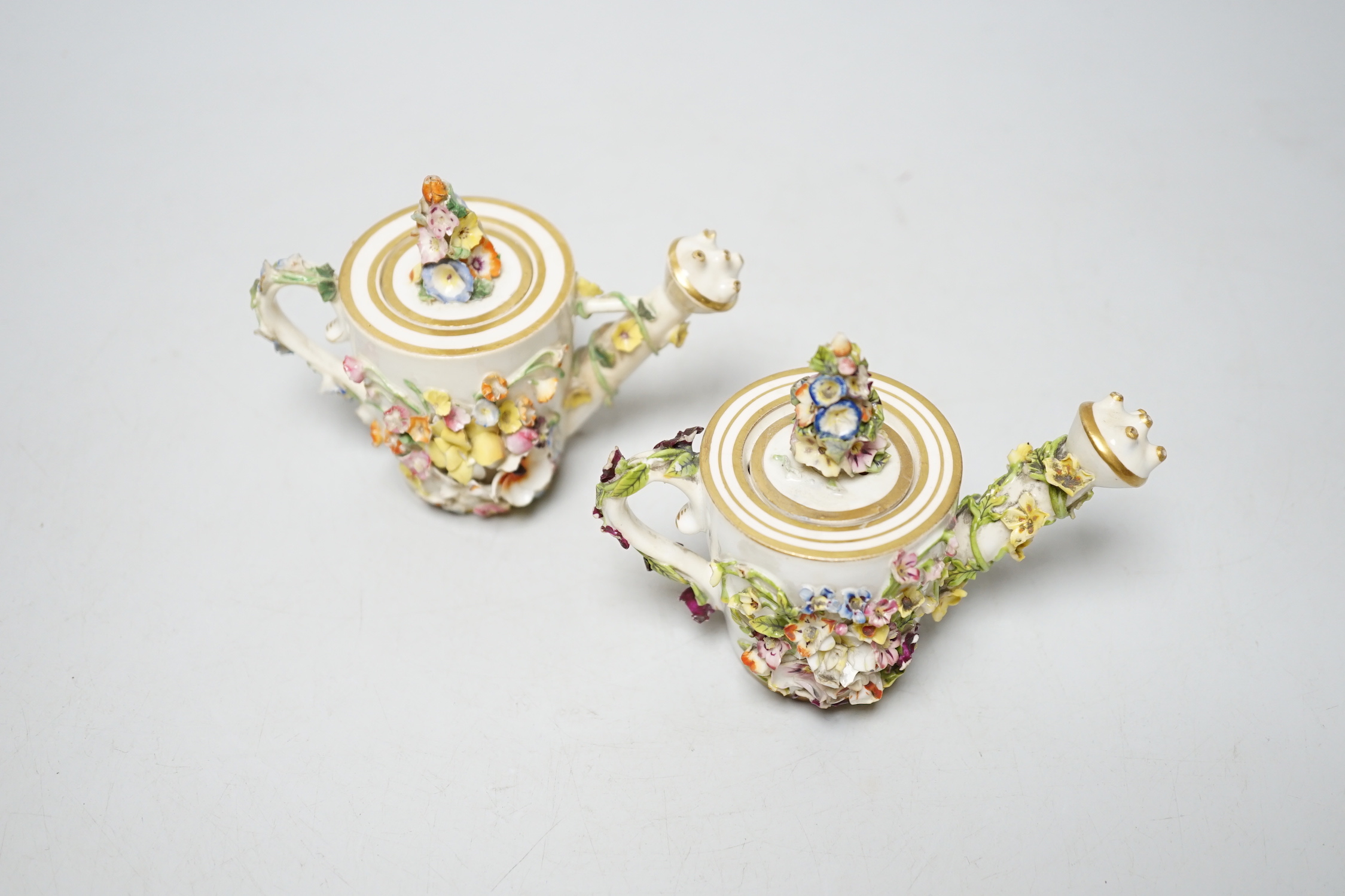 Two Derby porcelain floral encrusted miniature water sprinklers, circa 1825, 9cm high